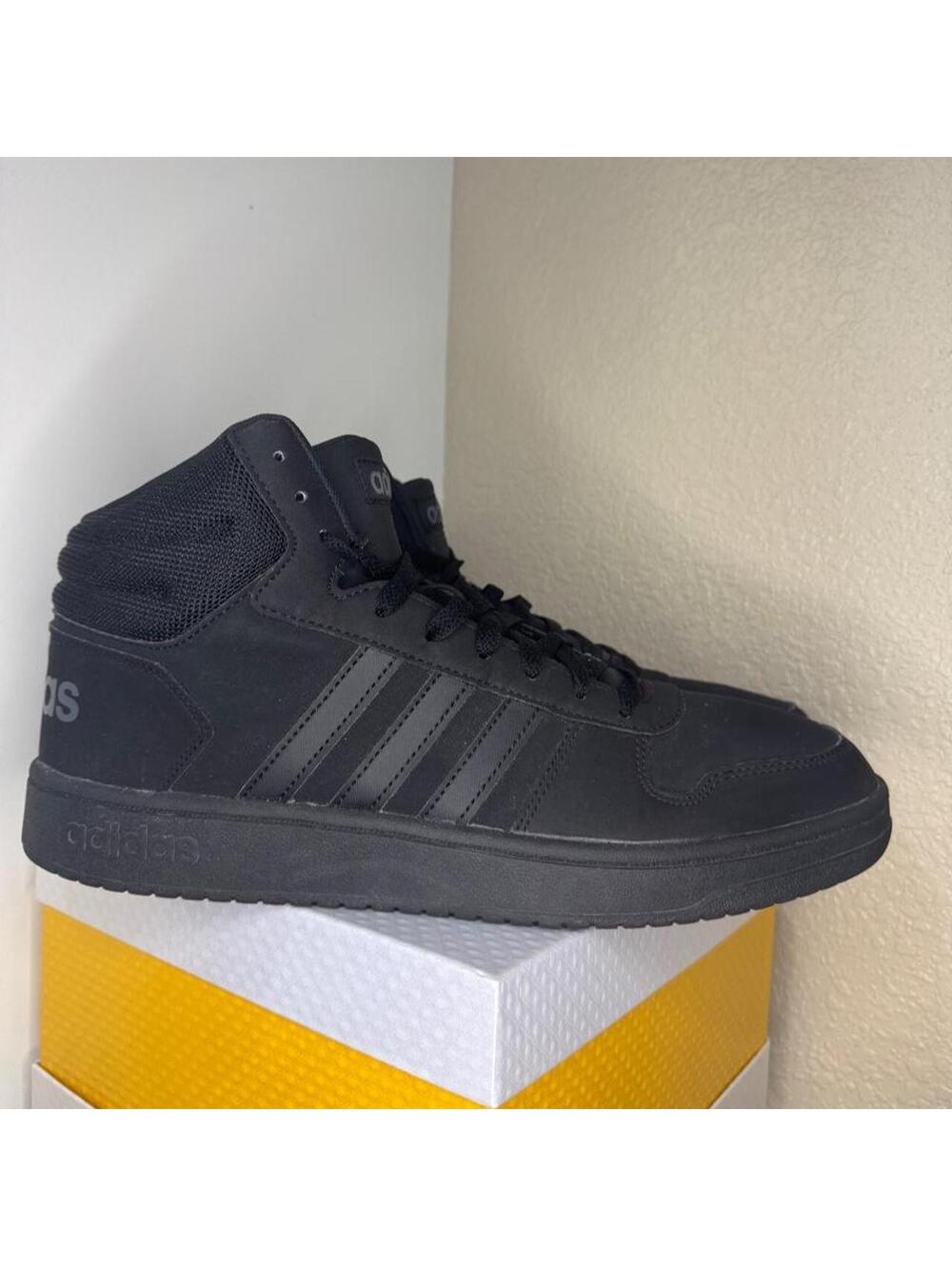 adidas Hoops 3.0 Mid sneakers in the versatile Triple Black colorway.